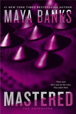 Paperback copy of "Mastered" by Berkley Books with a cover featuring bold typography and a dark, atmospheric background.