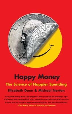 Paperback copy of "Happy Money: The Science of Happier Spending" by Simon & Schuster, featuring the book cover with title and author.