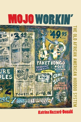 Paperback book titled "Mojo Workin': The Old African American Hoodoo System" by University of Illinois Press, with a close-up of the cover.