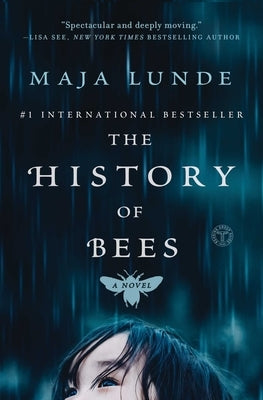 Paperback copy of "The History of Bees" by Atria Books, featuring a cover with bees and floral illustrations.