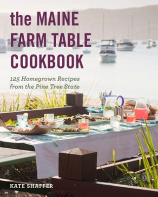 Paperback of The Maine Farm Table Cookbook with colorful cover featuring farm-fresh ingredients and rustic farmhouse design.