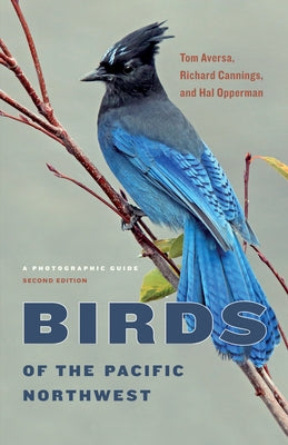 Paperback book titled "Birds of the Pacific Northwest: A Photographic Guide" with colorful bird images on the cover.