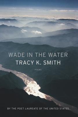 Paperback of "Wade in the Water: Poems" by Graywolf Press, featuring the book cover with title and artistic design.