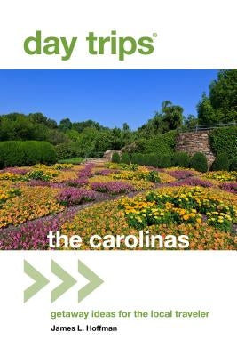 Paperback book titled "Day Trips The Carolinas" by Globe Pequot Press, featuring cover art with scenic images of the Carolinas.