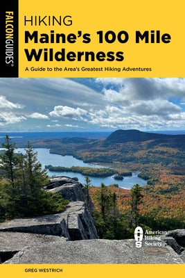 Paperback hiking guidebook titled "Hiking Maine's 100 Mile Wilderness" by Falcon Press Publishing, showing a scenic outdoor trail.