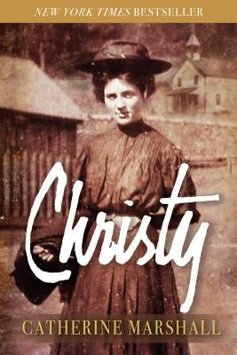 Paperback Christy novel by Evergreen Farm with a colorful cover, shown open on a wooden table.