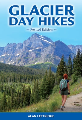 Paperback copy of Glacier Day Hikes: Revised Edition by Farcountry Press, showing the book cover with mountain scenery.