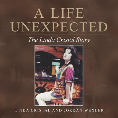 Paperback copy of "A Life Unexpected: The Linda Cristal Story" by Balboa Press, showing the book cover with title and author's name.