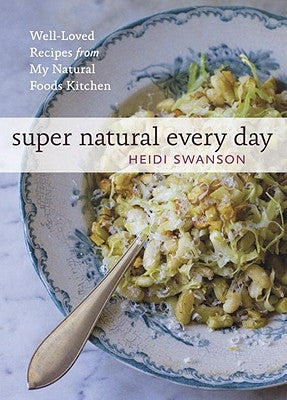 Open cookbook titled "Super Natural Every Day" showing colorful healthy recipes from Ten Speed Press's natural foods kitchen.