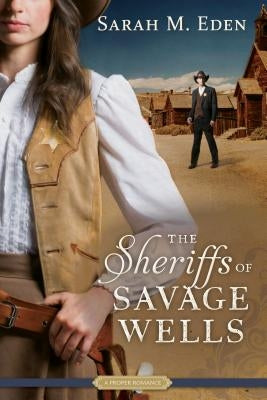 Paperback copy of The Sheriffs of Savage Wells by Shadow Mountain, featuring a book cover with western-themed artwork.