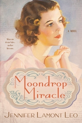 Paperback book titled "Moondrop Miracle" by Graphicomm, Inc., with a cover featuring celestial artwork and vibrant colors.