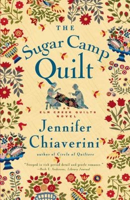 Paperback of The Sugar Camp Quilt novel by ELM Creek Quilts, featuring a cozy cover design with warm, inviting colors.