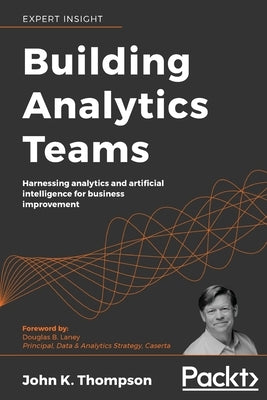 Paperback book titled "Building Analytics Teams" by Packt Publishing, featuring a cover with data analytics and AI imagery.