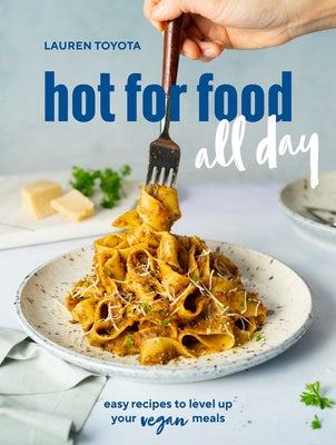 Open vegan cookbook "Hot for Food All Day" by Ten Speed Press showing colorful plant-based recipes on pages.
