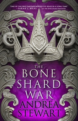 Paperback copy of The Bone Shard War novel by Orbit, featuring a dark fantasy cover illustration.