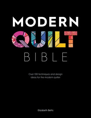 Open Modern Quilt Bible by David & Charles showing colorful quilt designs and technique pages for modern quilting inspiration.