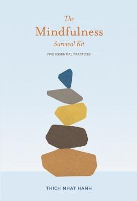 Open mindfulness survival kit with five essential practices, including meditation tools and guidebook by Parallax Press.