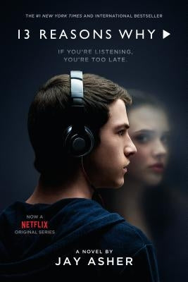 Paperback copy of 13 Reasons Why by Razorbill, featuring the book cover with artistic design and title text.