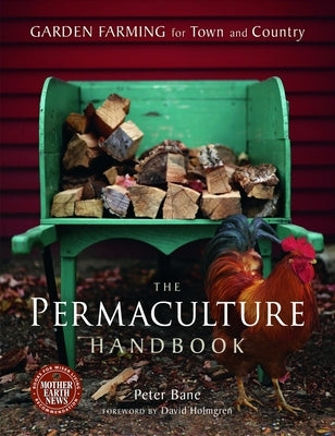 The Permaculture Handbook by New Society Publishers, open book showing garden and farming illustrations on a wooden table.