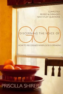 Paperback copy of "Discerning the Voice of God" by Moody Publishers, showing the book cover with title and publisher branding.