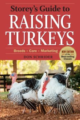 Paperback copy of Storey's Guide to Raising Turkeys, 3rd Edition by Storey Publishing, showing the book cover with title and author.