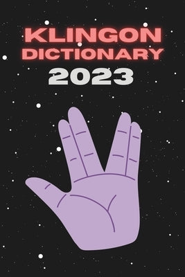 Paperback Klingon Dictionary 2023 by Independently Published, open to pages with Klingon language entries and translations.