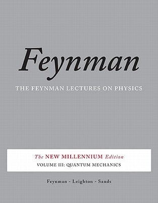 Paperback of Quantum Mechanics textbook by Basic Books, showing the front cover with scientific illustrations and title text.