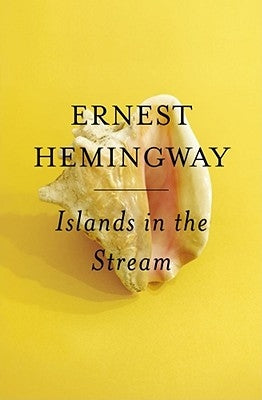 Paperback copy of "Islands in the Stream" by Hemingway, published by Scribner Book Company, with a cover featuring ocean scenes.