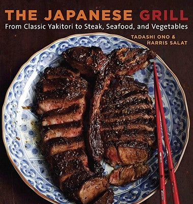 Paperback cookbook titled "The Japanese Grill" by Ten Speed Press showing grilled skewers, seafood, and vegetables on a Japanese-style grill.