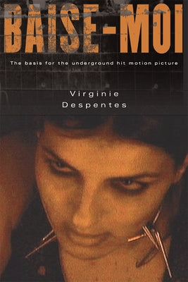 Paperback of Baise-Moi (Rape Me) by Grove Press, featuring the book cover with bold title and artistic design.