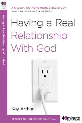 Paperback copy of "Having a Real Relationship with God" by Waterbrook Press, featuring a cover with spiritual imagery and warm tones.
