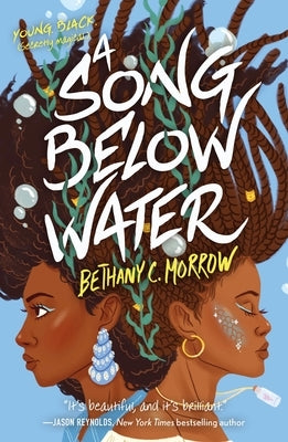 Paperback copy of "A Song Below Water" by Tor Teen, featuring the book cover with vibrant artwork and title text.