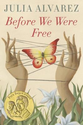 Paperback of "Before We Were Free" by Ember, showing the book cover with title and author details.