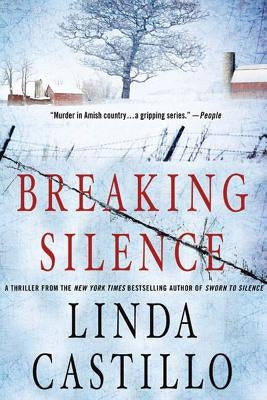 Paperback copy of "Breaking Silence," a Kate Burkholder novel published by Minotaur Books, with a cover featuring dark and suspenseful artwork.