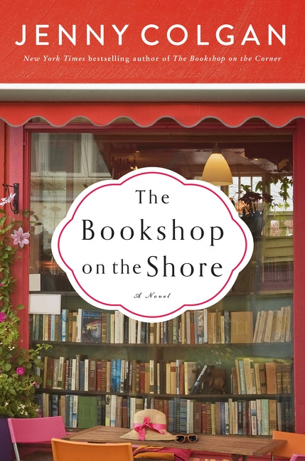 Paperback copy of "The Bookshop on the Shore" by Avon Books, showing the front cover with scenic seaside illustration.