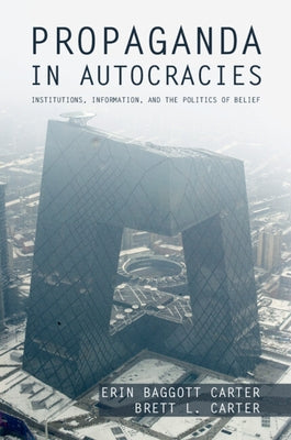 Paperback book titled "Propaganda in Autocracies" by Cambridge University Press, featuring a cover with political imagery.