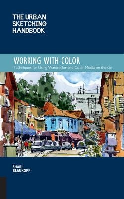 Open watercolor sketchbook with vibrant color washes and sketches, demonstrating urban sketching techniques in The Urban Sketching Handbook.