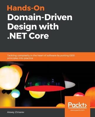 Paperback book titled "Hands-On Domain-Driven Design with .NET Core" by Packt Publishing, featuring a cover with software and code visuals.