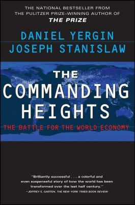 Paperback copy of The Commanding Heights by Free Press featuring the book cover with title and author text.
