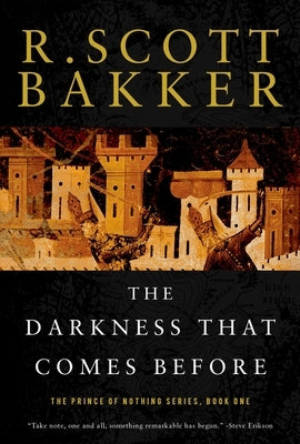 Paperback copy of "The Darkness That Comes Before: The Prince of Nothing" by Harry N. Abrams featuring dark fantasy cover art.