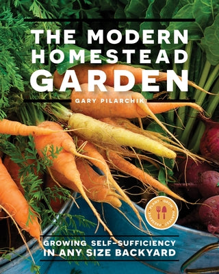 Paperback copy of The Modern Homestead Garden book by Cool Springs Press showing a lush backyard garden on the cover.