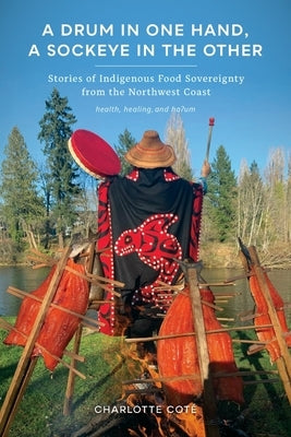 Cover image of "A Drum in One Hand, a Sockeye in the Other" book showing Indigenous artwork and title text on a colorful background.