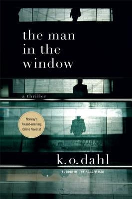 The Man in the Window: A Thriller Paperback Minotaur Books