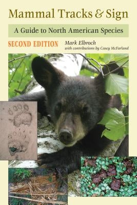 Paperback book titled "Mammal Tracks & Sign" by Stackpole Books, showing an illustrated page with various North American mammal tracks.