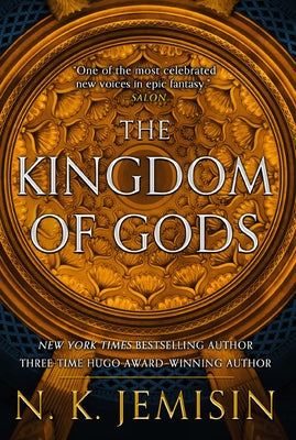 Paperback copy of "The Kingdom of Gods" by Orbit, featuring a cover with intricate fantasy artwork.