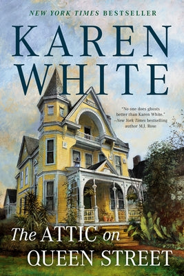 Paperback book titled "The Attic on Queen Street" by Berkley Books, showing the cover with a cozy attic scene.