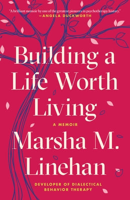 Paperback copy of "Building a Life Worth Living: A Memoir" by Random House Trade, featuring the book cover with title and author details.
