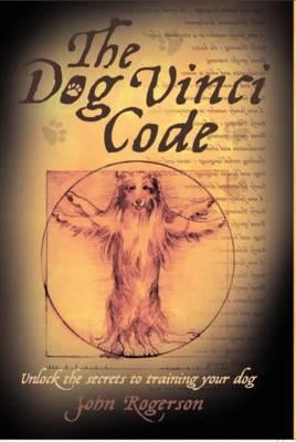 Paperback of The Dog Vinci Code by John Blake, featuring the book cover with title and author text.