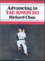 Open book titled "Advancing in Tae Kwon Do" with martial arts techniques and illustrations on white background.