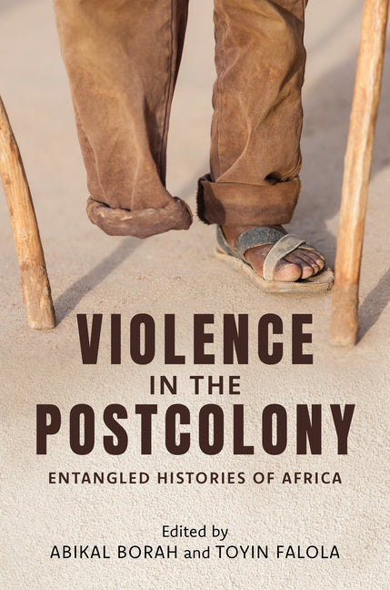 Paperback book titled "Violence in the Postcolony" by Indiana University Press, showing the cover with African historical imagery.